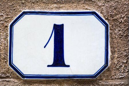 house number one ( 1 ) on a roughcast wallの写真素材