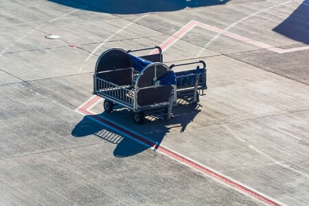 Empty luggage trolleys lined up at the airport. Baggage loading, airport trolley, luggage cartの写真素材