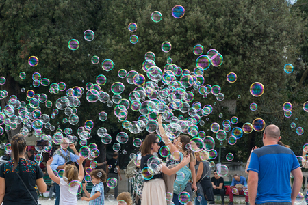 Rome, Italy - Oct 04, 2018: People rejoice in soap bubbles at Terrazza del Pincio in Romeのeditorial素材