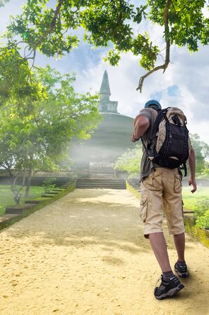 experienced tourist and a beautiful landscape as a backdropの写真素材