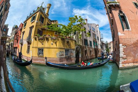 Venice, Italy - MAY 17, 2019: Tangled infrastructure in Venice, Labyrinth of canals and bridgesの写真素材