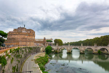 Rome, Italy - Oct 05, 2018: Tourists walking along the bridge of St. Angel, leading to the Castle of...