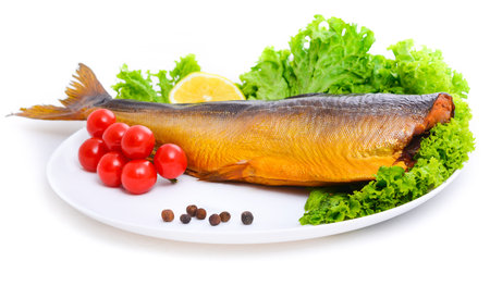 Appetizing smoked fish on a platterの写真素材