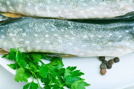 Group of dried fish at plate . Seafood