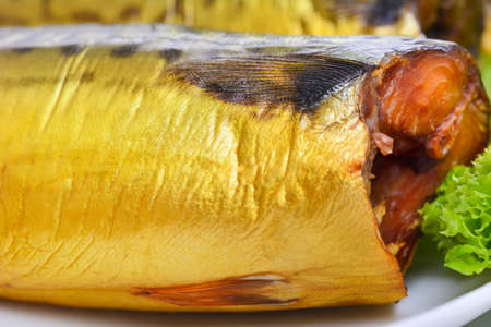 Appetizing smoked fish on a platterの写真素材