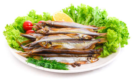 Dried smoked capelin on a plateの写真素材
