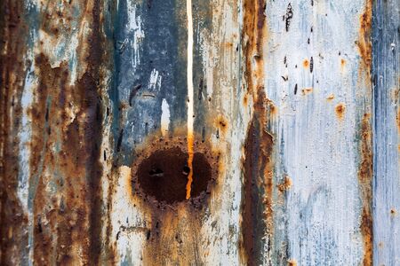red rusted on the color metal wall with planks. background and Texture for your design.