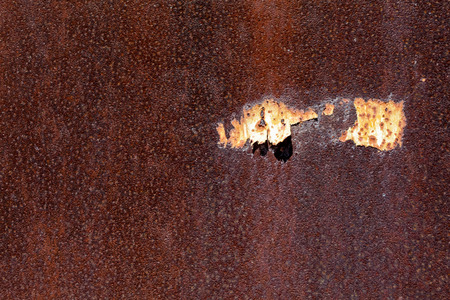 red rusted on the metal wall . background and texture