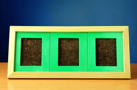 frame on a wooden table and a beautiful backdrop