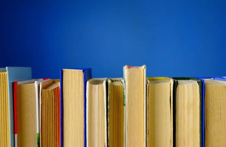 a lot of books on a blue backgroundの写真素材