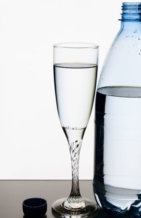 Mineral water in glass and plastic bottleの写真素材