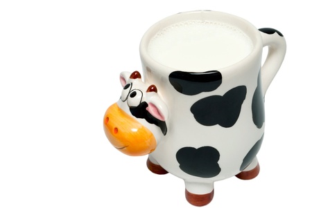 Cup in the form of a cow, a white background, a close up.の写真素材