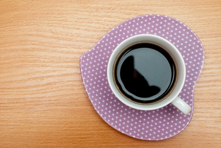 Coffee in the cup. Dish in the form of the heart.の写真素材