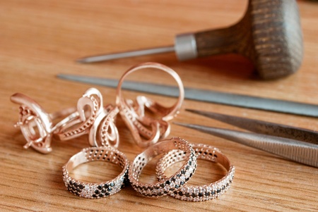 Jewelry and tools are on the tableの写真素材