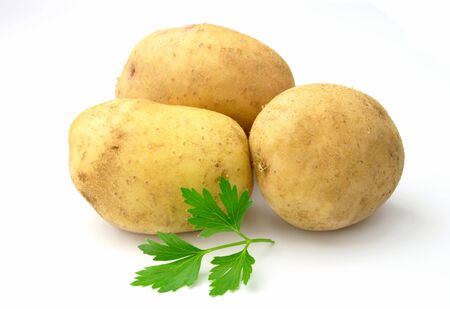 tubers of potatoes on a white backgroundの写真素材