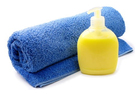 blue towel and a bottle of liquid soapの写真素材