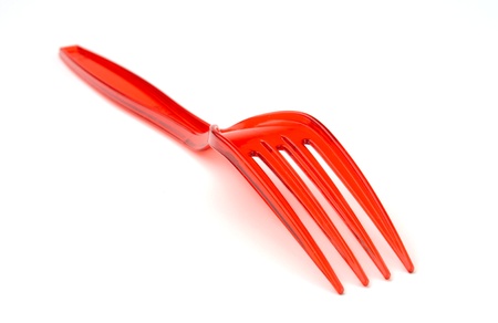 plastic fork on a white background, which is located diagonallyの写真素材