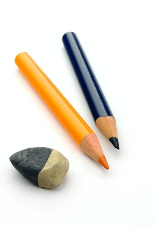 Pencils of yellow and dark blue color on a white backgroundの写真素材