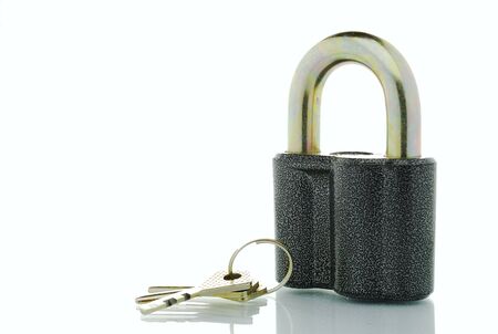 padlock and three keys on a white backgroundの写真素材
