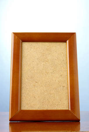 wooden photo frame on a blue background