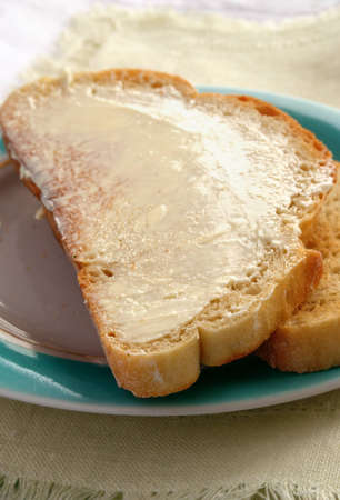 fried bread in a buttered dish for breakfastの写真素材