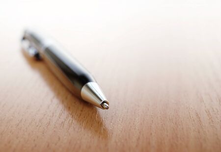 ballpoint pen on a table and a place for your text