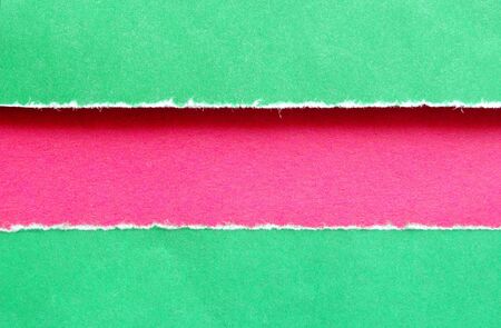 background torn green and red paperの写真素材
