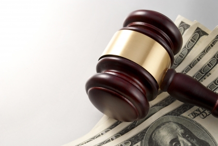 gavel and dollars on a gray gradient backgroundの写真素材