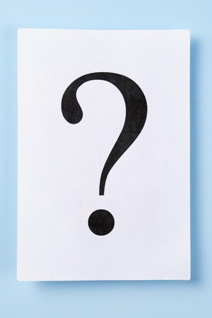 big question mark on a white sheet of paperの写真素材