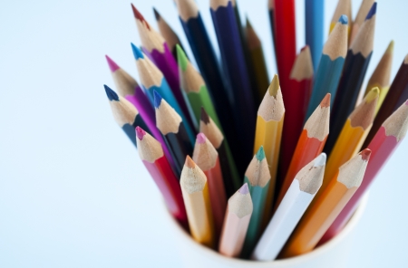 pencils in a plastic cup on the tableの写真素材