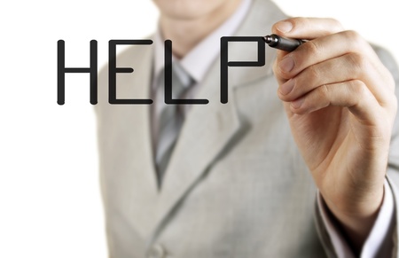 Businessman writing on screen help, shot closeupの写真素材