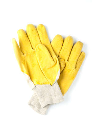 yellow work gloves on a white backgroundの写真素材