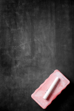blank blackboard in wooden frame with white chalk dust and eraser smudgesの写真素材
