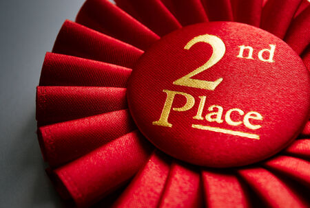2nd place winners rosette in red with gold text made of pleated ribbon to be awarded to the runner...
