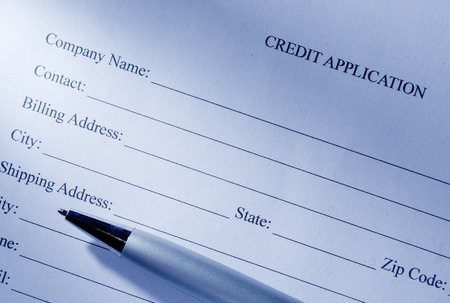 Close up Conceptual Blank Credit Application Form and Pen on Top of the Table.の写真素材