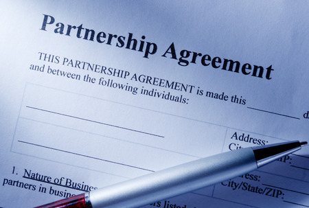 Close up Partnership Agreement Paper and Pen, Emphasizing the Title Part.