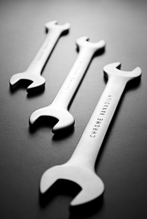 Close up Three Open Ended Wrenches Hand Tools Positioned Diagonally on a Gray Background.の写真素材