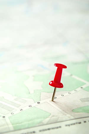 Conceptual Red Pin Marking on a Green White Map with Copy Space on the Left Side. Captured in Close...