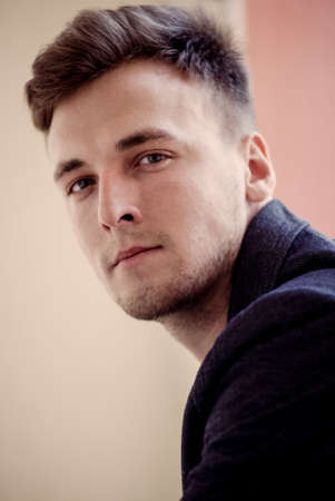 Portrait of beautiful young men closeup, looking at the cameraの写真素材
