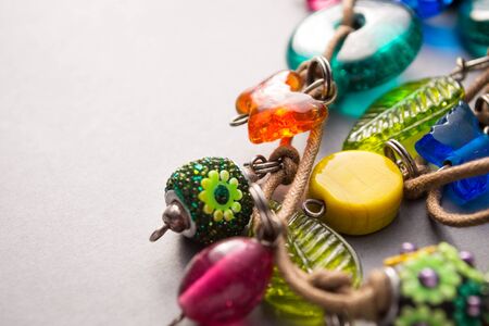 Close Up of Handmade Artisan Jewellery on White Background with Copy Space - Necklaces and Bracelets...