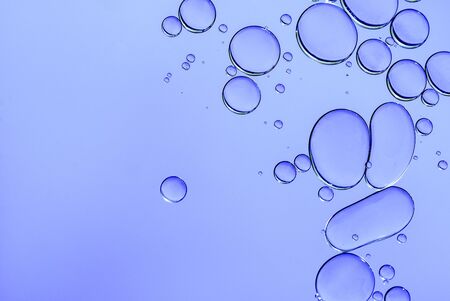 oil drops on a water surface abstract background  blue