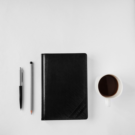 Top view of an office desk with stationery itemsの写真素材