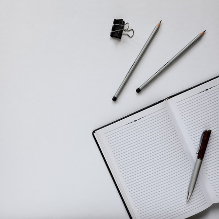 Top view of an office desk with stationery items