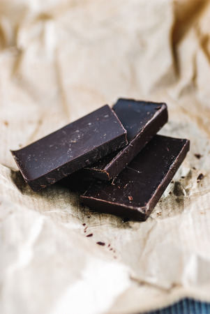 Pieces of chocolate tile on kraft paper