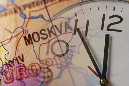 Double exposure of clock and map with European cities Moscow and Kievの写真素材
