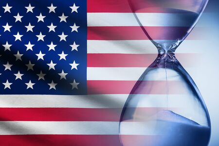 Stars and Stripes American flag with an hourglassの写真素材
