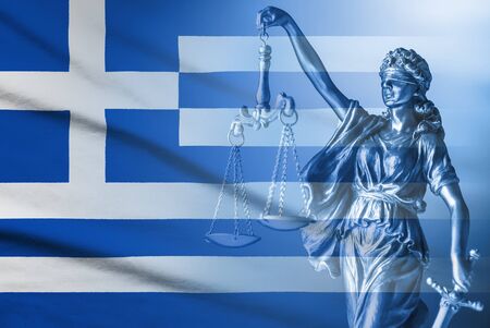 Greek flag and figure of Justice in a full frame background conceptual of law and order and impartialityの写真素材