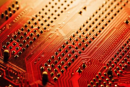 The motherboard and a lot of small parts and chips for the computerの写真素材