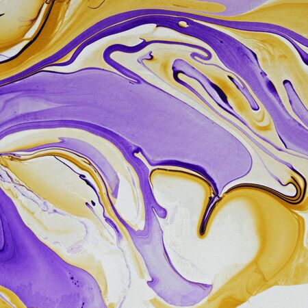 Square format DIY marbling effect in yellow and purple with fluid swirls in a full frame background...