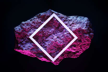 Red meteorite in dark space with white frame and copy space neon lighting.の写真素材